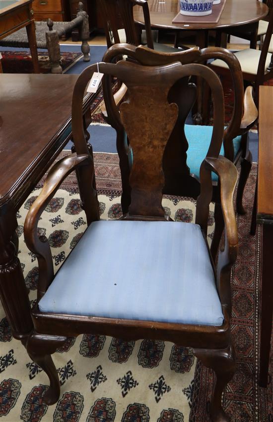 A set of six walnut Queen Anne style dining chairs (two with arms)